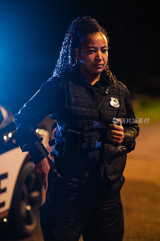 Professional Blaсk Female Police Officer Looking at the Camera. Policewoman Maintains public order and safety, Enforcing the Law, Prevents and Investigates Criminal Activity. Cinematic Portrait